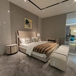 Diamond-Tufted Leather Bed with Curved High-Gloss Wood Side Borders